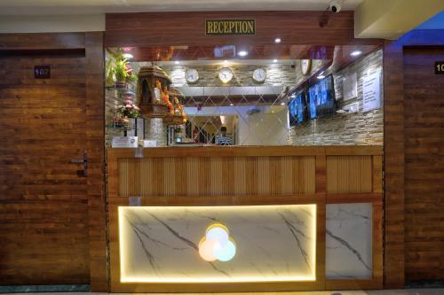 a restaurant with a sign that reads reputation at Hotel Saineel Residency in Mumbai