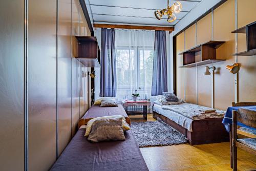 a room with two beds and a window at Hotel Garni in Liptovský Mikuláš