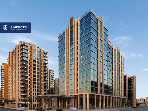 a rendering of a tall building with glass windows at Novotel Dubai Gold District in Dubai