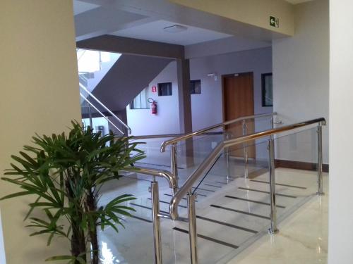 a staircase in a building with a plant at Sleep Hotel in Toledo