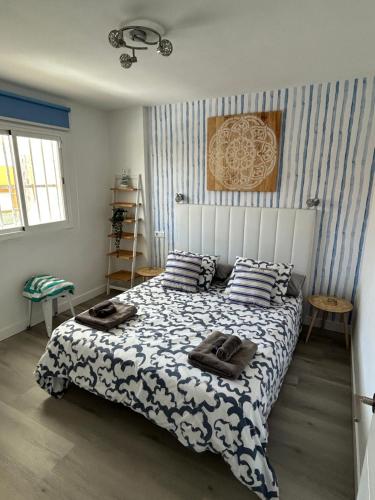 a bedroom with a bed with pillows on it at Casa Maja in Costa de Antigua