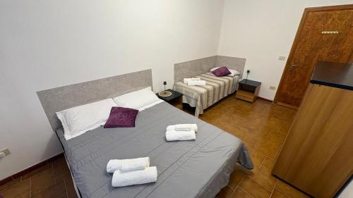 a bedroom with a bed with two pillows on it at Casa Vacanze "La Casetta" in Configni