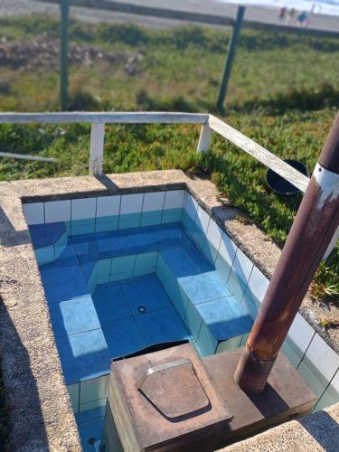 a tiled pool with a baseball bat on top at Ilocavistamar in Iloca