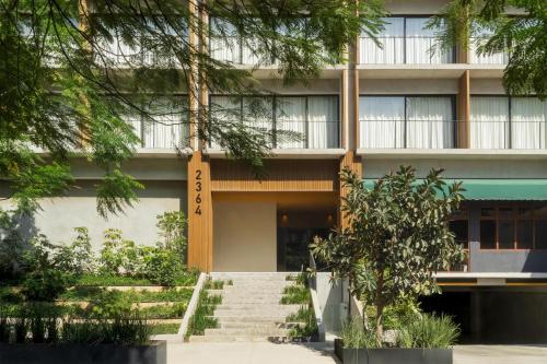 a building with a staircase in front of it at NH Guadalajara Studios in Guadalajara