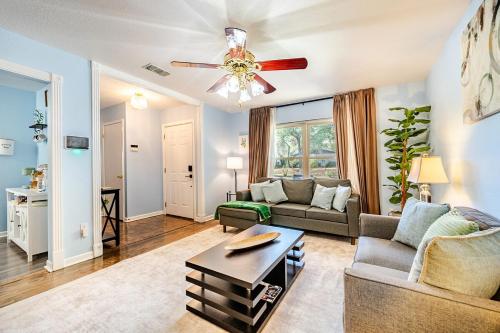 a living room with a couch and a ceiling fan at 3 BR l Quiet Home with Gazebo l 5 min Medical center l Work room in San Antonio