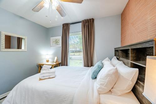 a bedroom with a white bed and a window at 3 BR l Quiet Home with Gazebo l 5 min Medical center l Work room in San Antonio