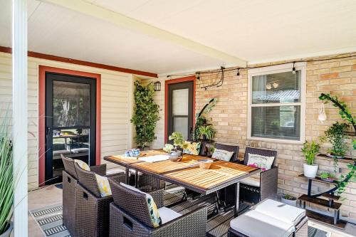 an outdoor patio with a wooden table and chairs at 3 BR l Quiet Home with Gazebo l 5 min Medical center l Work room in San Antonio