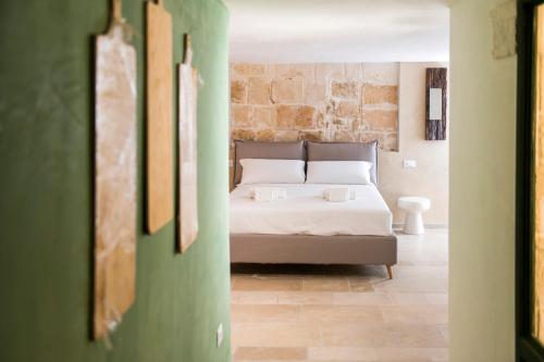 a bedroom with a bed in a room at Profumo Antico - Luxury Guesthouse by STHEY in Monopoli