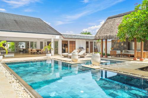 an image of a swimming pool in a villa at Clos du Littoral by Sealodge Mauritius in Grand-Baie