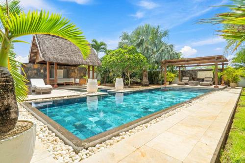 an image of a swimming pool in a villa at Clos du Littoral by Sealodge Mauritius in Grand-Baie