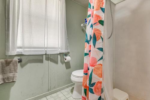 a bathroom with a toilet and a shower curtain at Steps to St Albans Bay! Basecamp w/ Grill in Saint Albans Bay