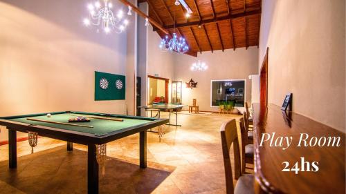 a ping pong table in a room with a ping pong ball at Edenia Hotel & Nature in El Calafate