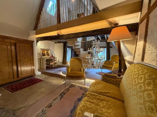 a large living room with a couch and chairs at Our Hippie Castle Vianden - Unique Bohemian Guesthouse in Vianden