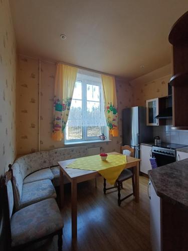 a living room with a couch and a table at MERE Apartment in Sillamäe