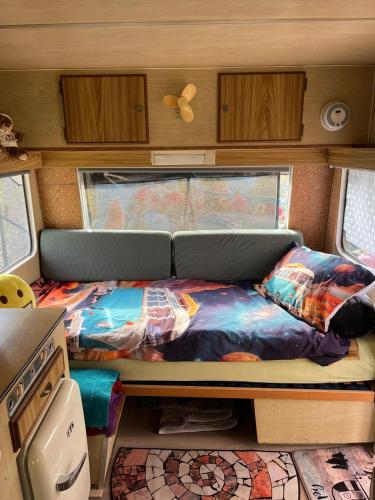 a bed in the back of a rv at Tinyhaus am Flughafen, der DLR und ESA in Cologne