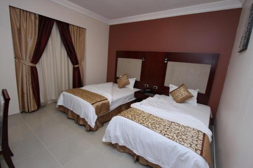 Katil atau katil-katil dalam bilik di نزل تالا للشقق المخدومة - Tala nezel Serviced Apartments