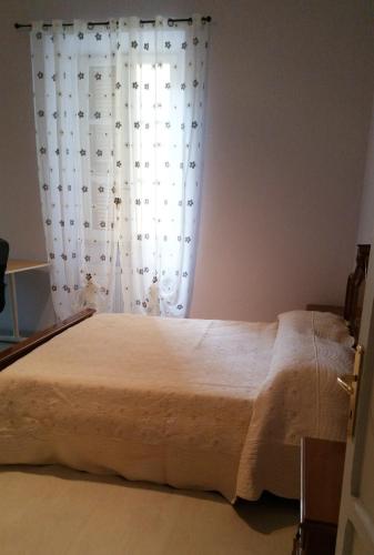 Postel nebo postele na pokoji v ubytování Appartamento Pellico