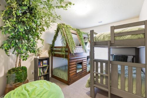 a room with two bunk beds and a book shelf at The Treehouse in Escondido in Washington