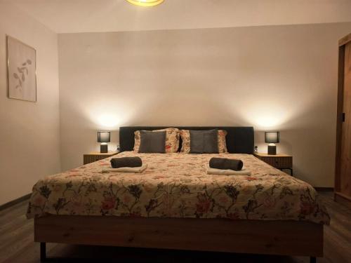 a bedroom with a bed with two pillows on it at Jinn's Valley Apartment in Grižane