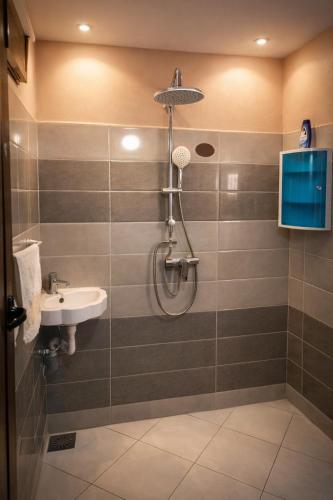 a bathroom with a shower and a sink at Chez BABAYO BY DADES in Zaouïet Sidi Daoud
