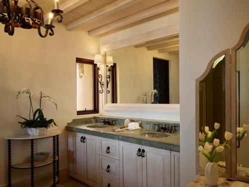 a bathroom with a sink and a mirror at Waldorf Astoria Los Cabos Pedregal in Cabo San Lucas