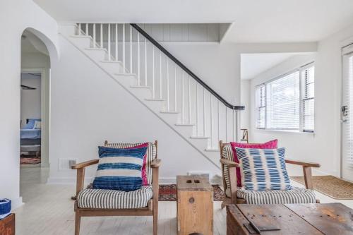 a living room with two chairs and a table at Hygge House in Harbert
