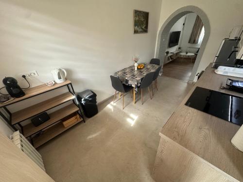 a kitchen and dining room with a table and chairs at Crystal Lakes Apartment in Plitvička Jezera