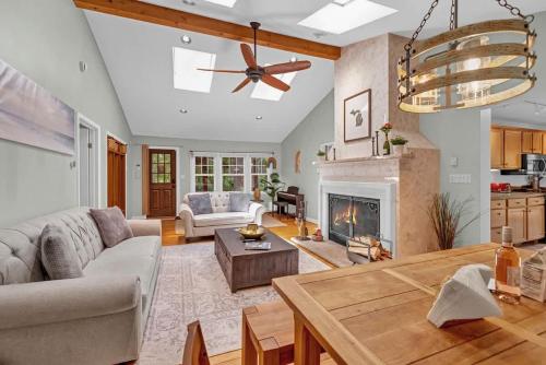 a living room with a couch and a fireplace at Wonderwood Cottage in Sawyer