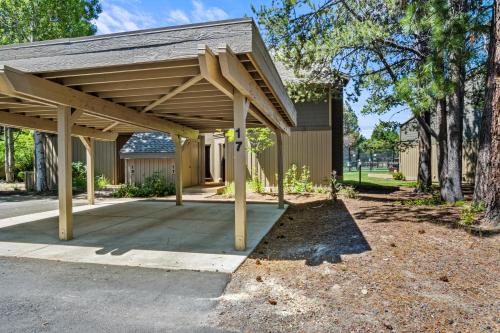a wooden pavilion in front of a building at 17 Quelah Condo in Sunriver