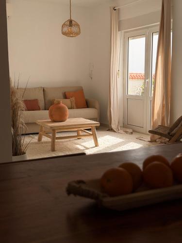 a living room with a couch and a table at Dodos Guardias Viejas - Almerimar in El Ejido