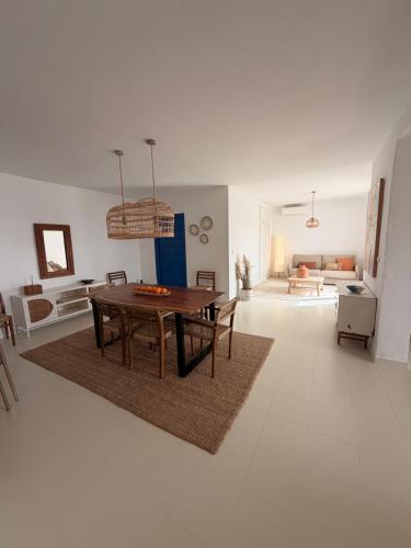 a living room with a table and a couch at Dodos Guardias Viejas - Almerimar in El Ejido