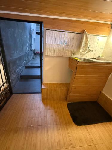 a kitchen with a sink and a counter top at Уютная комната in Ganja