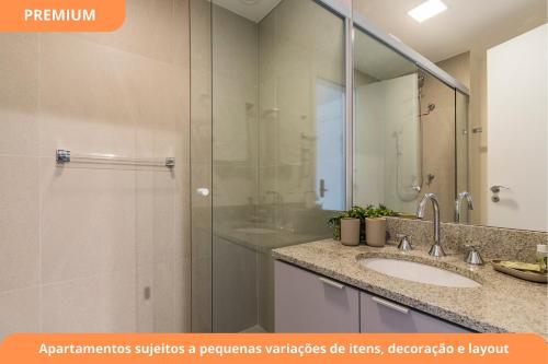 a bathroom with a shower and a sink and a mirror at Connect João Wallig by My Way in Porto Alegre