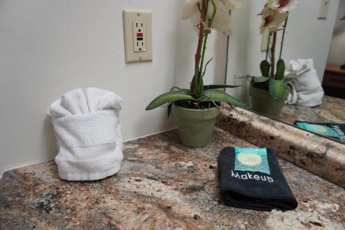a towel on a counter with a book and a mirror at River Place Condos #508 2BD in Pigeon Forge