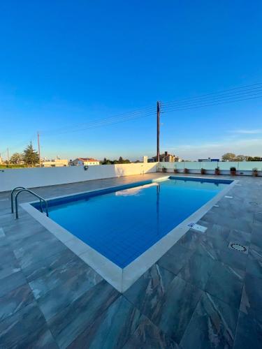 a swimming pool on the roof of a building at Daniel's Hotel Apartments in Paphos