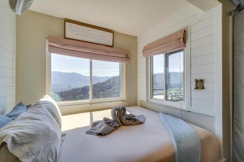 a bedroom with a bed and a large window at Studio about 3 Mi to Great Smoky Mountain Natl Park! in Gatlinburg