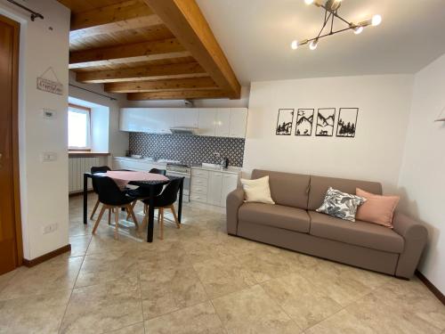 a living room with a couch and a table at Casa Elisa in Onore