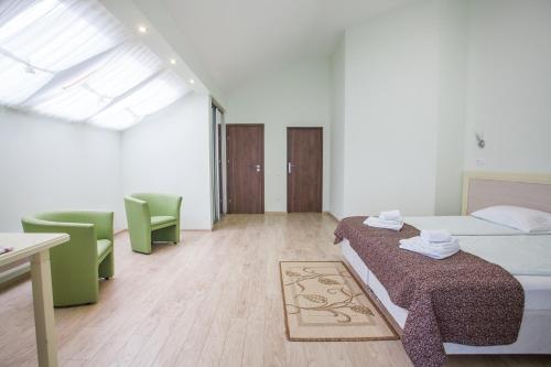 Ένα ή περισσότερα κρεβάτια σε δωμάτιο στο Hotel Zolotaya Milya
