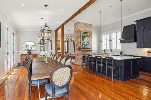 a kitchen and dining room with a table and chairs at Opulent Expansive Unit Heated Pool and Spa in New Orleans
