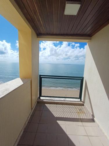 a balcony with a view of the ocean at Flat Costa Mar in Recife
