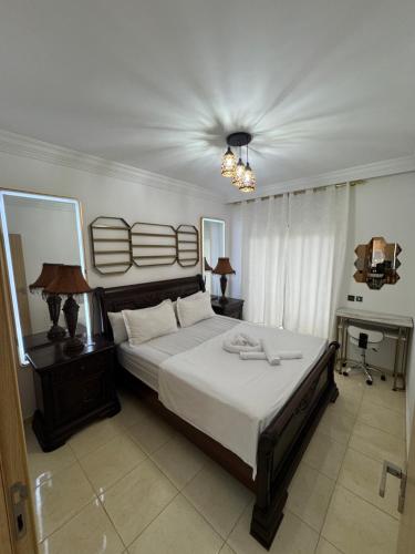 a bedroom with a large bed and a piano at Appartement de luxe à Tanger Maroc in Tangier