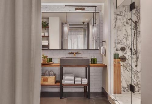 a bathroom with a sink and a mirror at 1 Hotel Central Park in New York