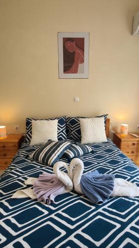 a bedroom with a bed with towels on it at Villa Carma in Kos
