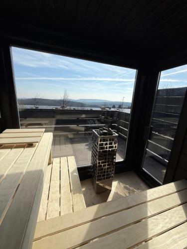 a view from the inside of a building with a window at Chalet Schneeglück Winterberg mit Sauna Terrasse Grill 11 Gäste in Winterberg