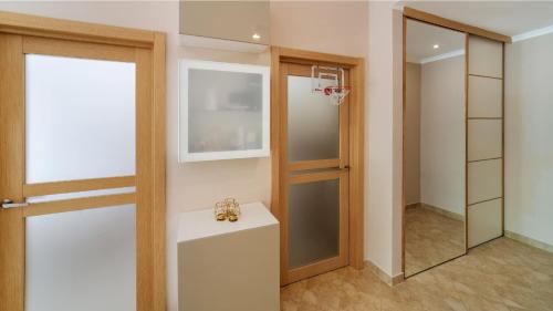 a dressing room with a basketball hoop and a mirror at Private Terrace Living - Blue Flag Beach & Family Retreat near Kotor in Gornji Orahovac