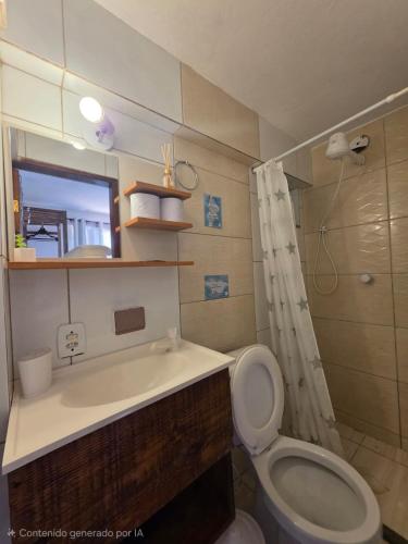 a bathroom with a toilet and a sink and a shower at Namorada Brava Guest House Praia Brava, Piscina & Naturaleza in Búzios