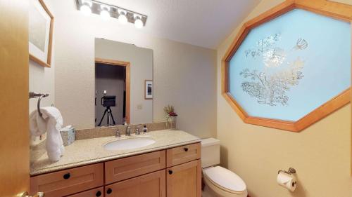 a bathroom with a sink and a window at 62 Wildflower in Sunriver