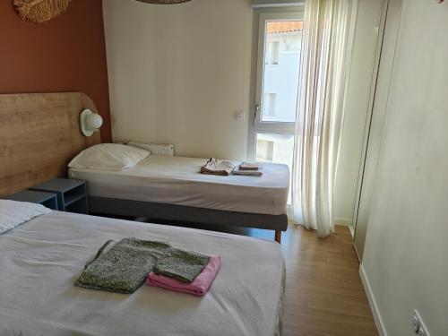 Llit o llits en una habitació de L'orée Royannaise