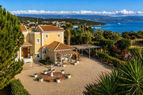 an aerial view of a house with a garden at Acqui Apartments in Argostoli