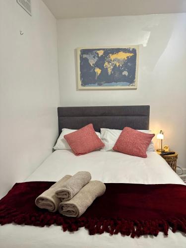 a bedroom with a bed with two towels on it at Little Gem in Dublin